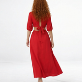 Vestido midi rojo con escote en V cruzado, manga abullonada y cut out laterales, vibrante y femenino para eventos especiales y celebraciones
