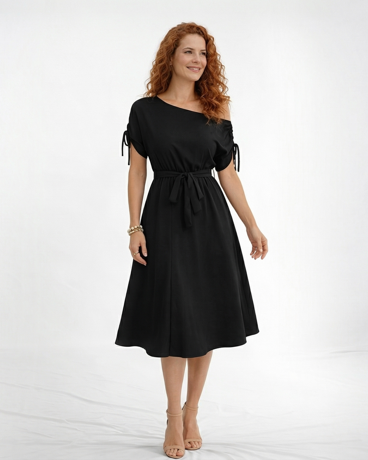 Vestido midi negro hombro asimétrico con manga corta y lazo en puño, cintura con lazo y falda midi con vuelo, sofisticado para eventos y salidas de noche