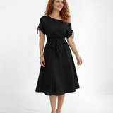 Vestido midi negro hombro asimétrico con manga corta y lazo en puño, cintura con lazo y falda midi con vuelo, sofisticado para eventos y salidas de noche