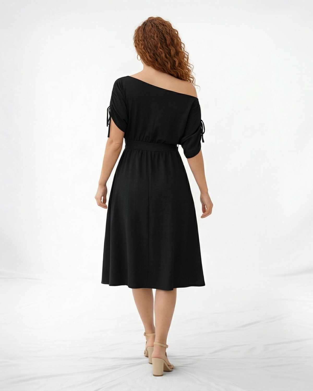 Vestido midi negro hombro asimétrico con manga corta y lazo en puño, cintura con lazo y falda midi con vuelo, sofisticado para eventos y salidas de noche