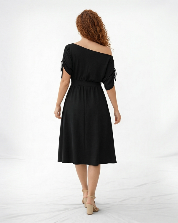 Vestido midi negro hombro asimétrico con manga corta y lazo en puño, cintura con lazo y falda midi con vuelo, sofisticado para eventos y salidas de noche
