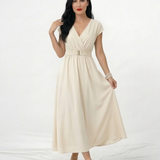 Vestido midi marfil cruzado con escote en V, manga corta, cinturón dorado y falda amplia con vuelo, romántico y elegante para bodas, grados y eventos especiales