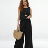 Conjunto negro de top cropped sin mangas con cuello redondo y pantalón palazzo de tiro alto con pinzas, sofisticado y versátil para eventos, reuniones y salidas de noche