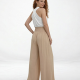 Pantalón ancho beige cintura alta con lazo frontal y pinzas, fluido y femenino para salidas elegantes, fiestas y eventos especiales en Colombia