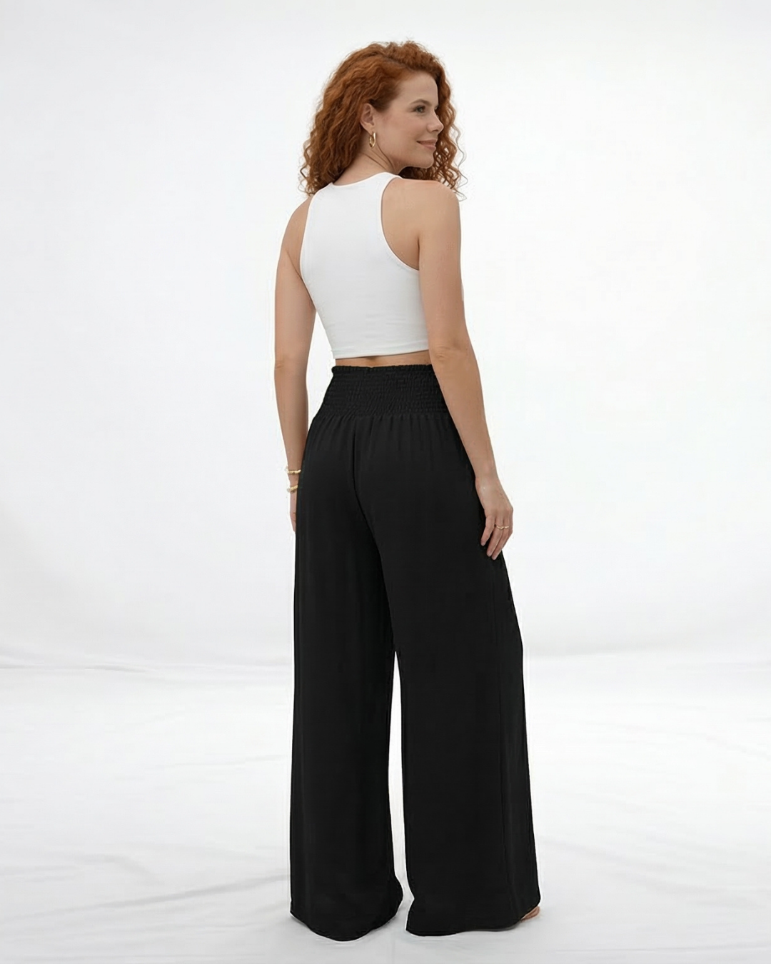 Pantalón ancho negro cintura alta con lazo frontal y pinzas, clásico y versátil para fiestas, grados y salidas elegantes en Colombia