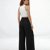 Pantalón ancho negro cintura alta con lazo frontal y pinzas, clásico y versátil para fiestas, grados y salidas elegantes en Colombia