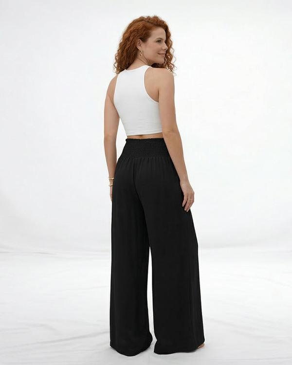 Pantalón ancho negro cintura alta con lazo frontal y pinzas, clásico y versátil para fiestas, grados y salidas elegantes en Colombia