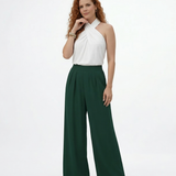 Pantalón palazzo verde cintura alta con pinzas frontales y tela fluida, sofisticado para fiestas, matrimonios y salidas elegantes en Colombia