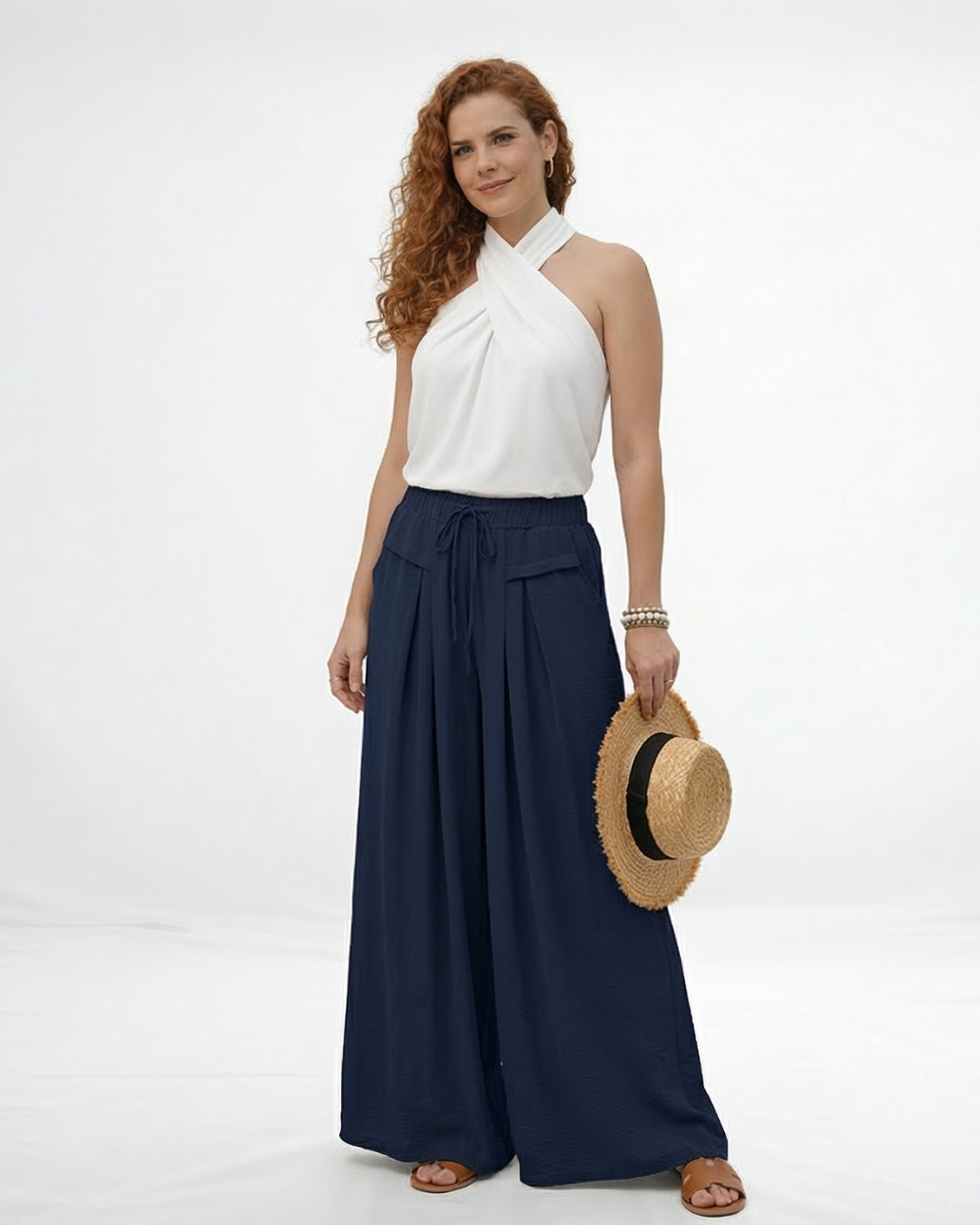 Pantalón palazzo azul marino super fluido con cintura elástica alta, cordón y pinzas frontales, fresco y elegante para fiestas, salidas y viajes en Colombia