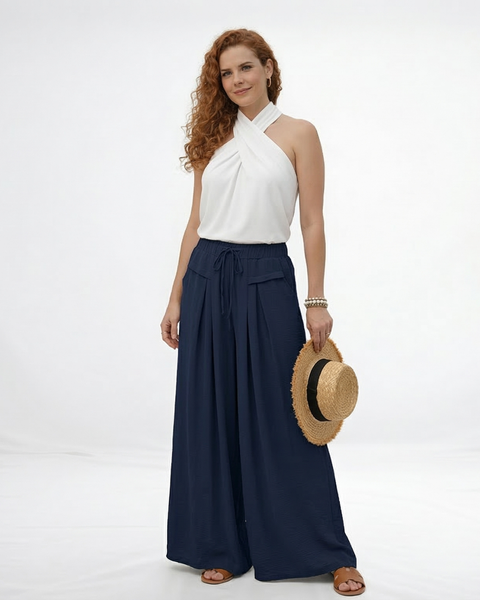 Pantalón palazzo azul marino super fluido con cintura elástica alta, cordón y pinzas frontales, fresco y elegante para fiestas, salidas y viajes en Colombia