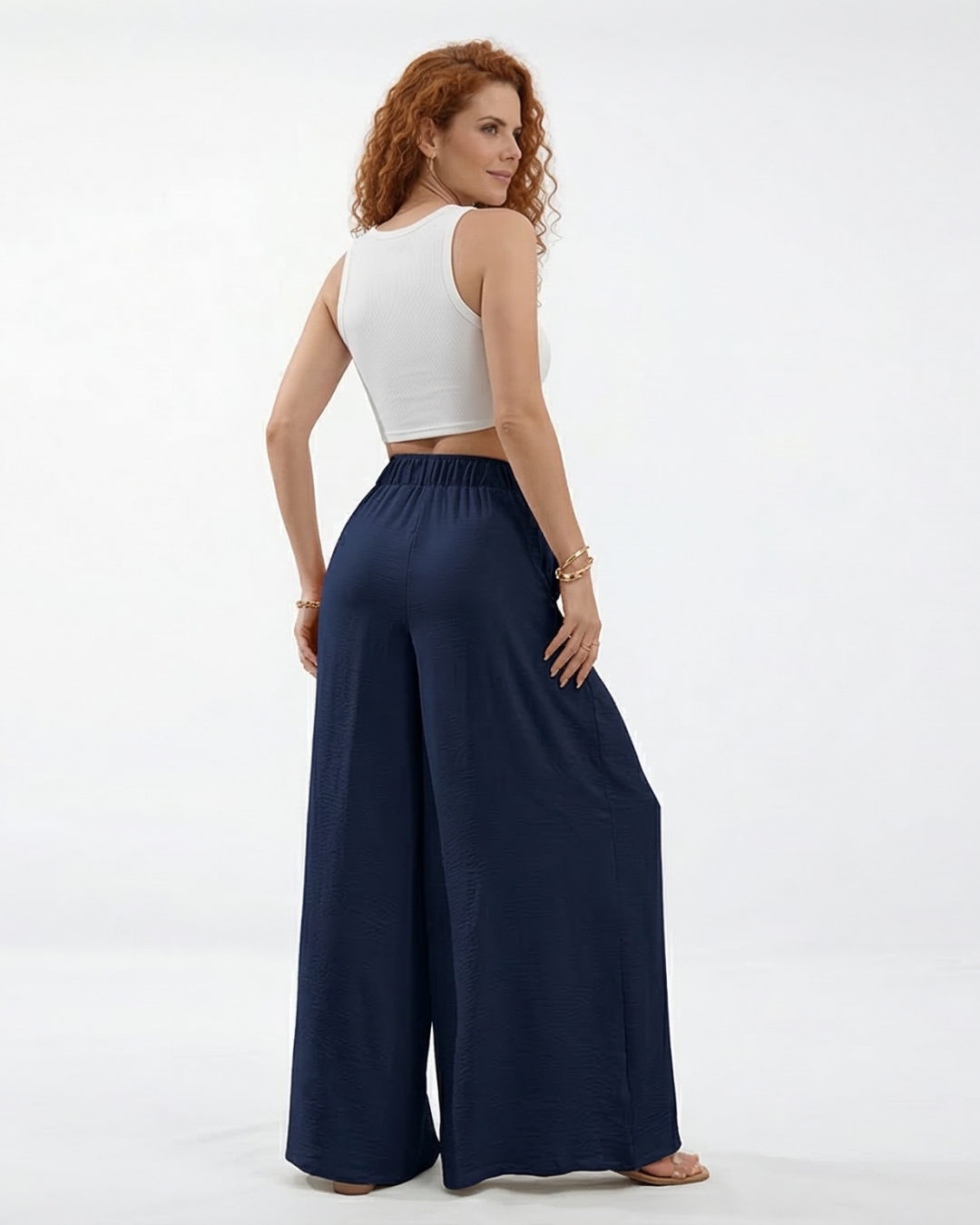 Pantalón palazzo azul marino super fluido con cintura elástica alta, cordón y pinzas frontales, fresco y elegante para fiestas, salidas y viajes en Colombia