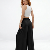 Pantalón palazzo negro super fluido con cintura elástica alta, cordón y pinzas frontales, versátil y sofisticado para fiestas, grados y matrimonios en Colombia
